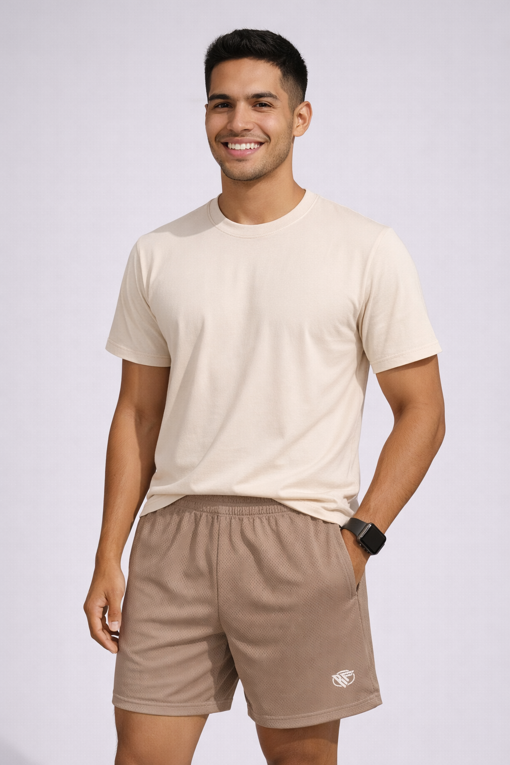 Man wearing a natural colored t-shirt and RF-Wear Men's Mesh Solid Color Shorts in Tan