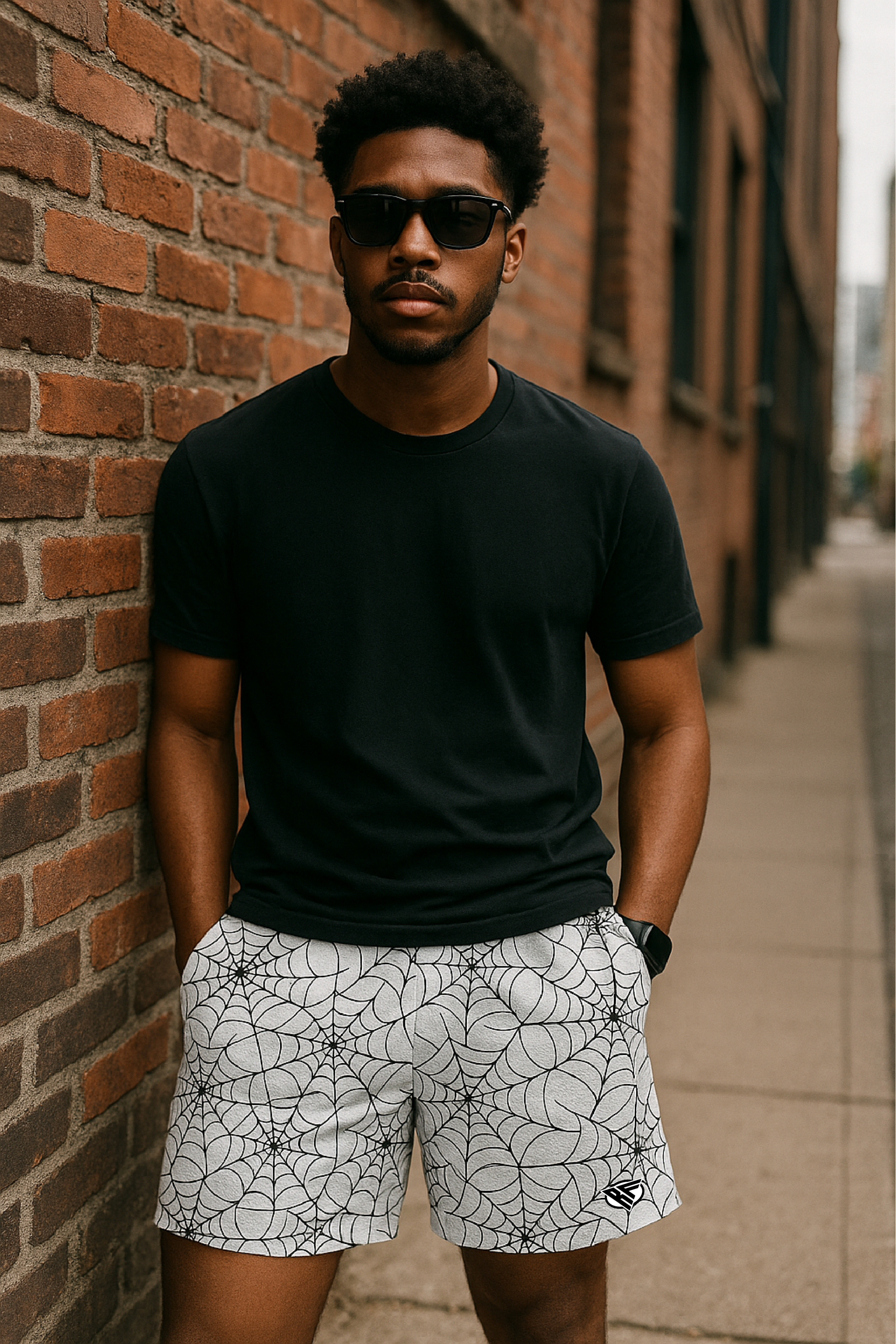 Man wearing a black t-shirt and RF-Wear Men's Mesh Spider Web Shorts in White