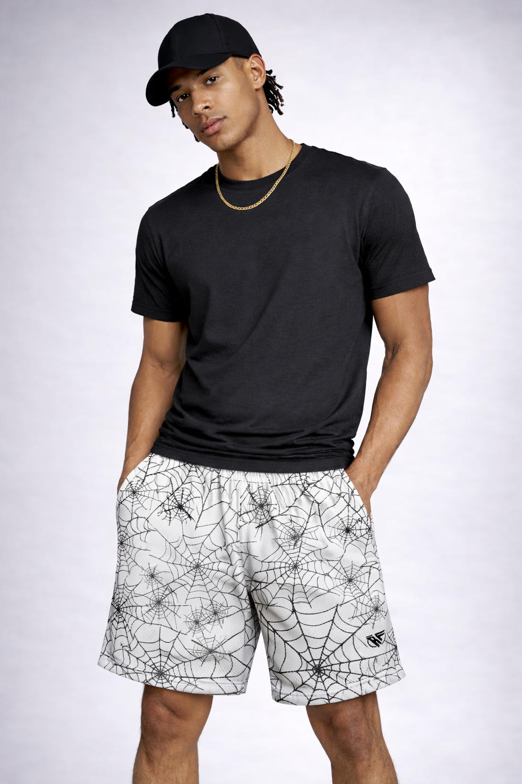 Man wearing a black top and cap, and RF-Wear Men's Mesh Spider Web Shorts in White