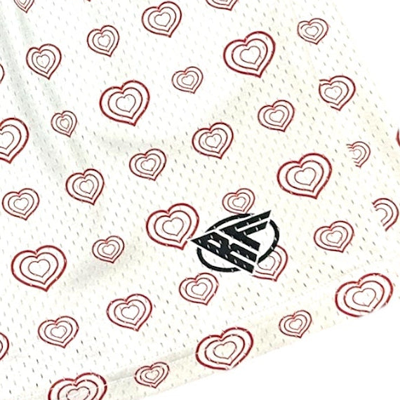 Close-up of RF-Wear Men's Cupid/Heart Shorts in Red/White with RF logo