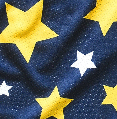 Close-up of RF-Wear Men's mesh shorts in navy color with a pattern of yellow and white stars