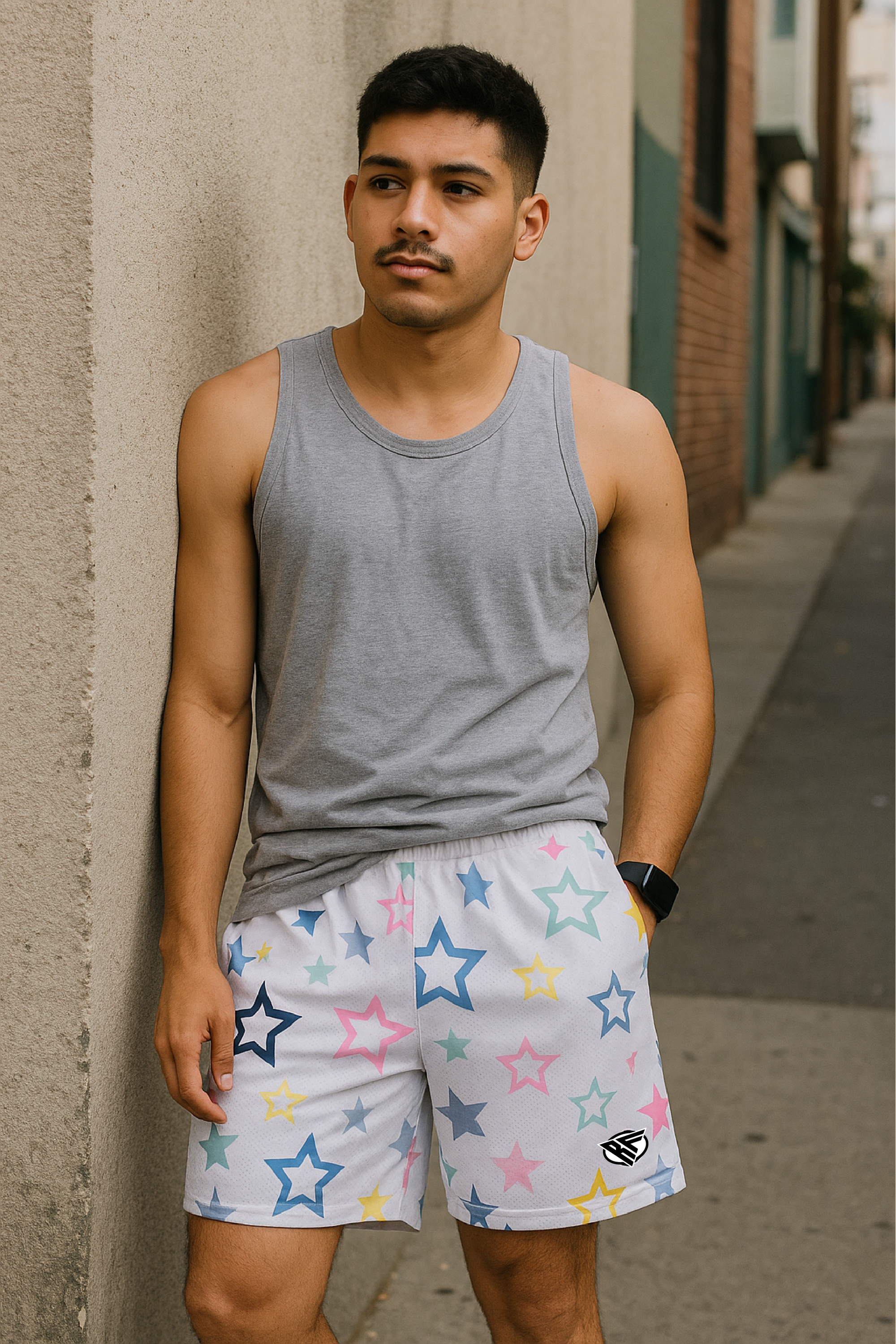 Man wearing Grey Tank Top and RF-Wear Men's Mesh Star Shorts in White/Multicolor. 