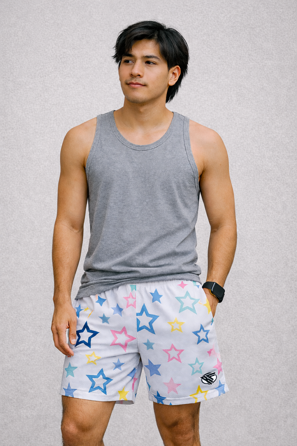 Man wearing a grey tank top and RF-Wear Men's Mesh Star Shorts in White/Multicolor