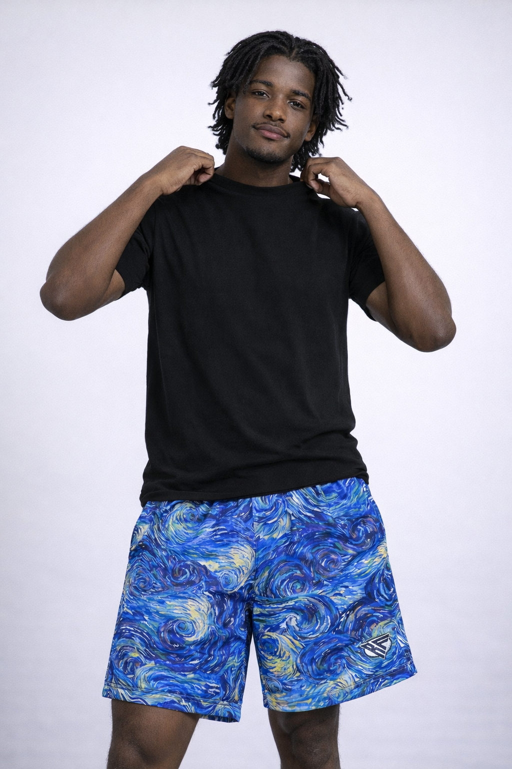 Man wearing a black t-shirt and RF-Wear Men's Mesh Starry Shorts in  Blue