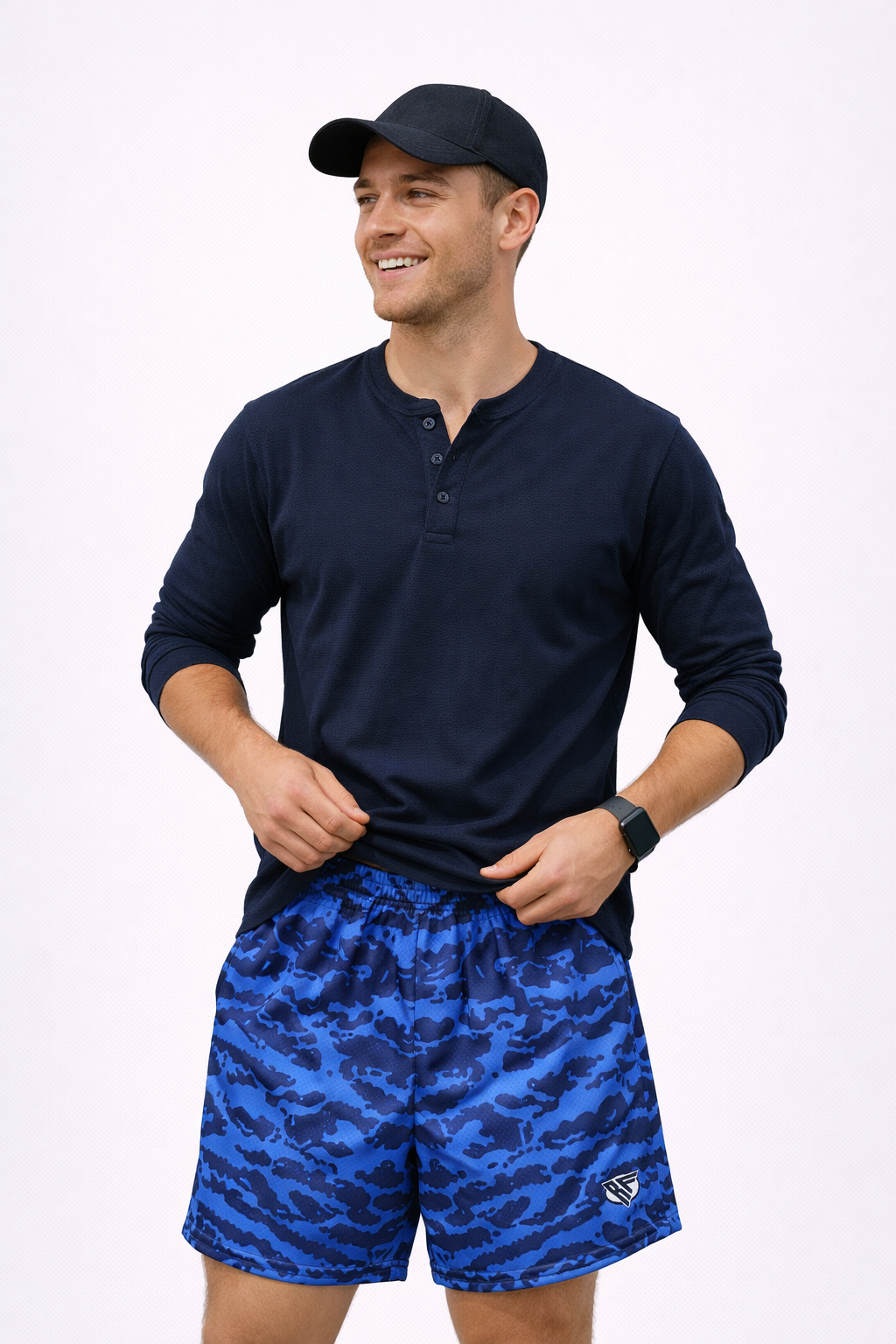 man wearing a long sleeve navy shirt and RF-Wear Men's Mesh Tiger Camo Shorts in Blue