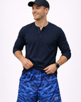 man wearing a long sleeve navy shirt and RF-Wear Men's Mesh Tiger Camo Shorts in Blue