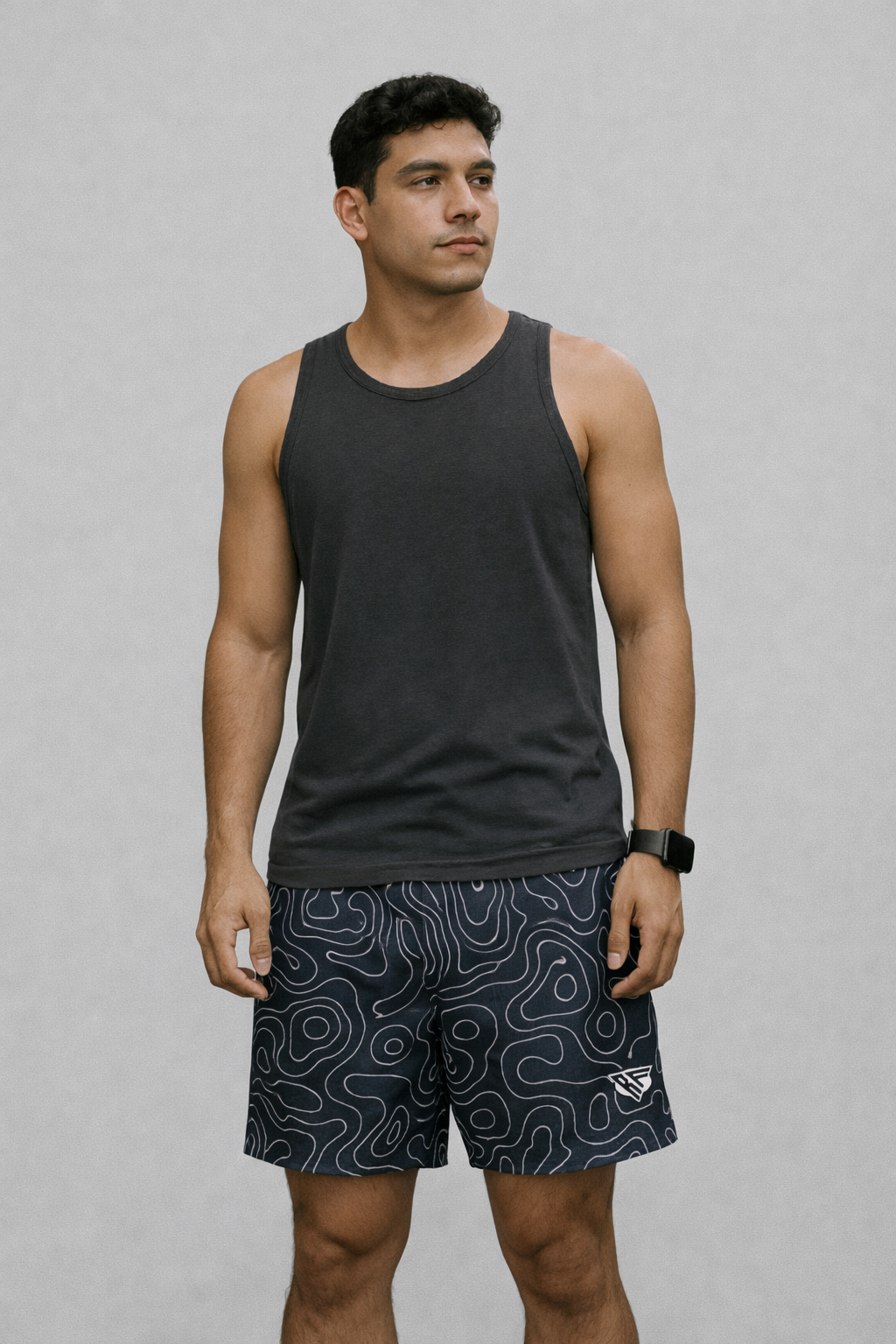 Woman wearing a grey tank top and RF-Wear Men's Mesh Topography Shorts in Navy/Cream. 