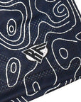 Close-up of RF-Wear mesh topography shorts in Navy/Cream with RF logo. 