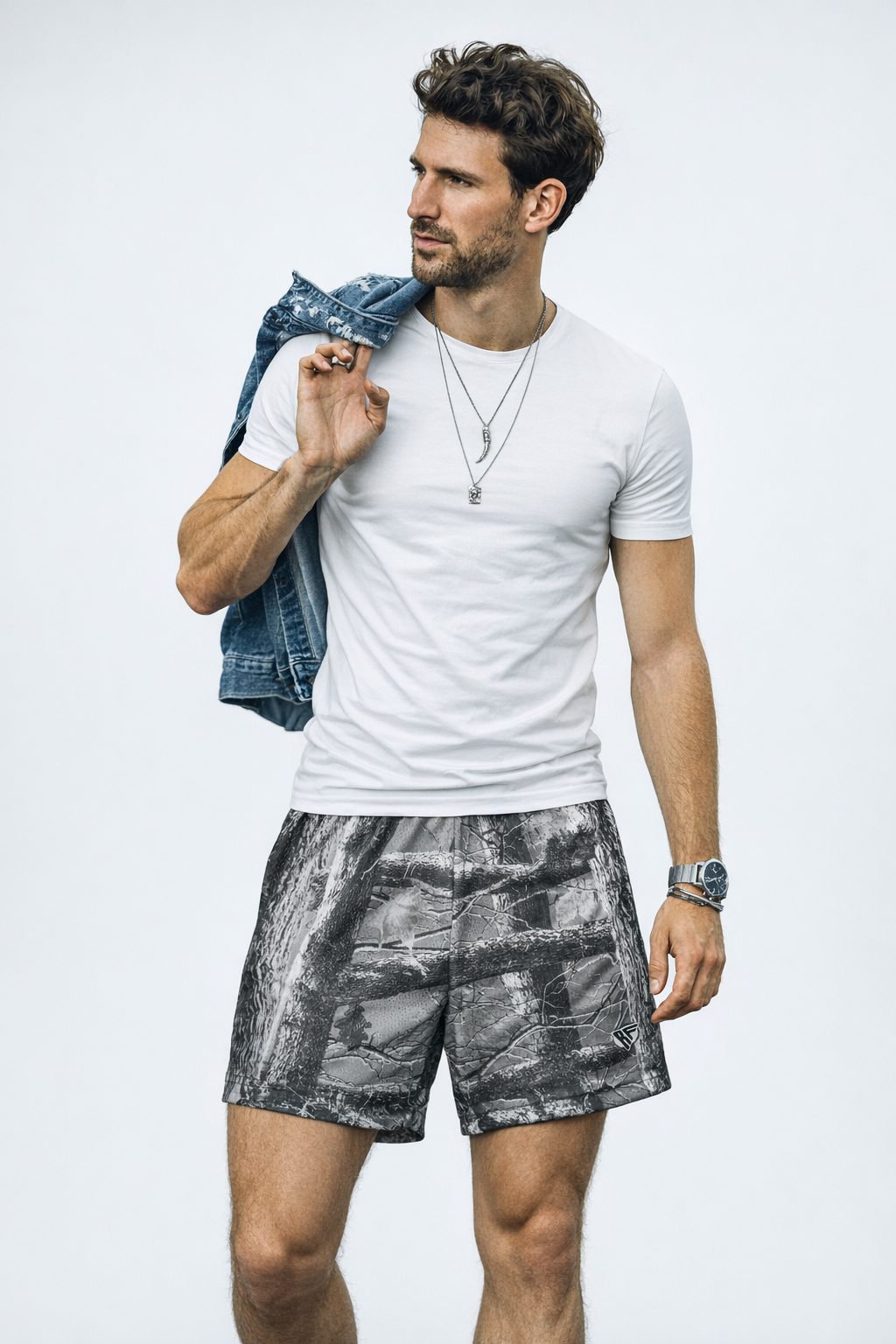 Man wearing a t-shirt and RF-Wear Men's Mesh Tree Camo Shorts in Grey