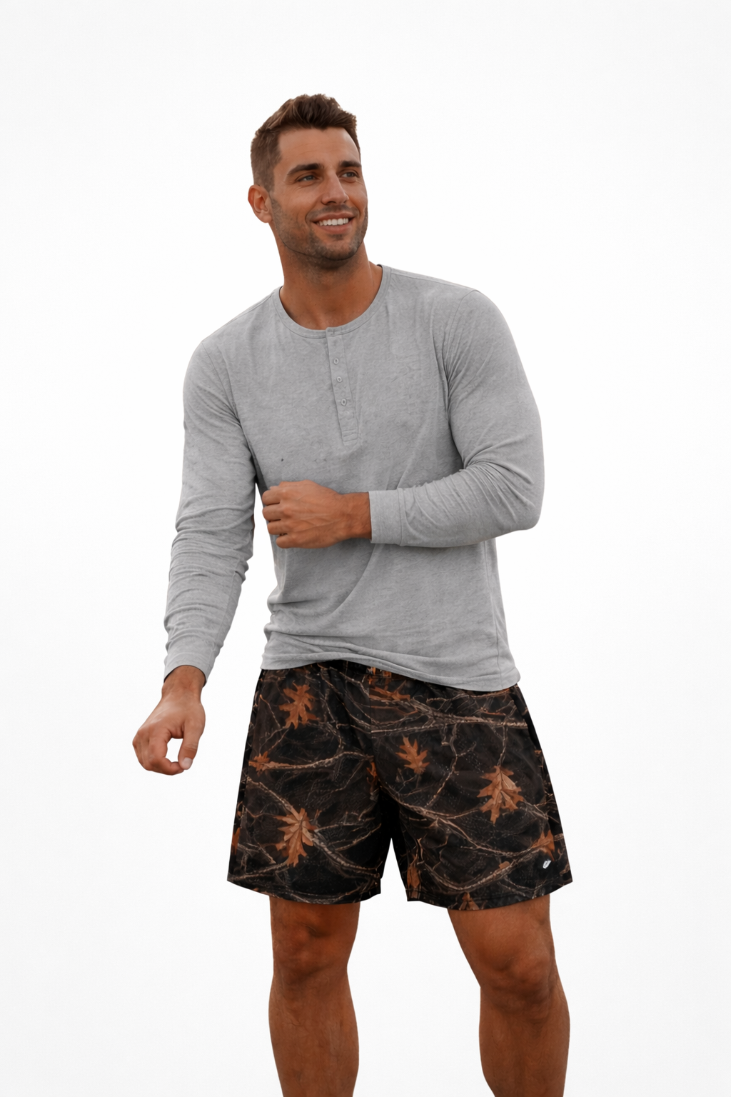 Man wearing a grey shirt and RF-Wear Men's Mesh Tree Camo Shorts Night