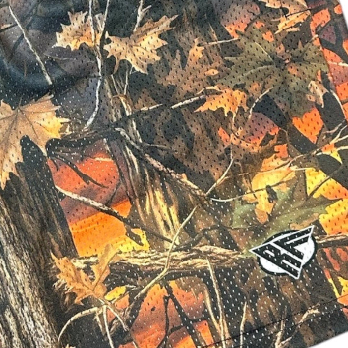 Close-up of RF-Wear Men's Mesh Tree Camo Shorts in Sunset with RF logo