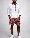 Man wearing a white RF-Wear Hoodie and RF-Wear Men's Mesh Tropical Flower Shorts in Coral on Black