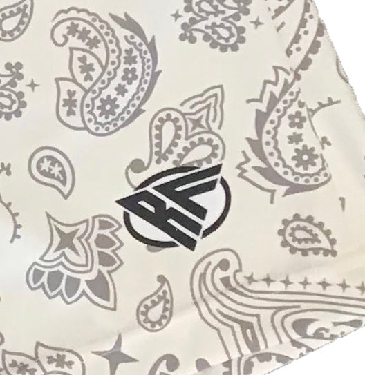 Close-up of RF-Wear Men's Paisley Shorts in Cream/Grey with RF logo