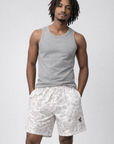 Man wearing a grey tank top and RF-Wear Men's Paisley Shorts in Cream/Grey 