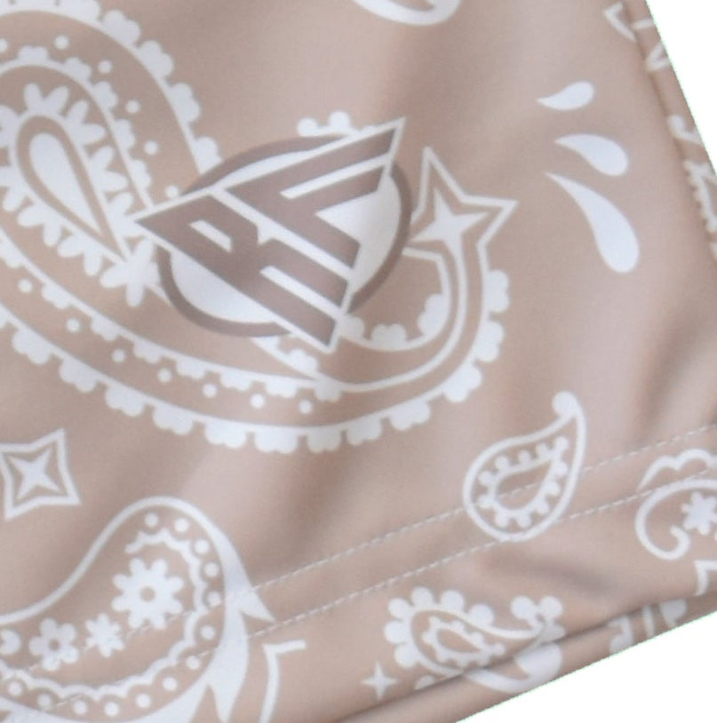 Close-up of RF-Wear Men's  Paisley Shorts in Tan/White with RF logo