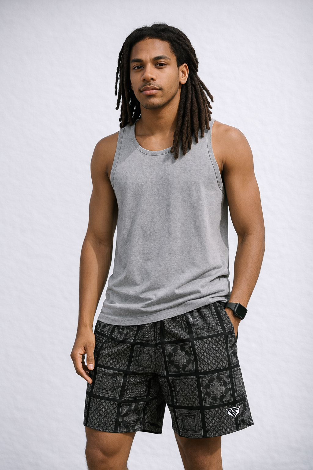 Man wearing a grey tank top and RF-Wear Men's Bandana Patchwork Shorts in Black