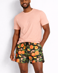 Man wearing a peach t-shirt and RF-Wear Men's Peach Splash Shorts