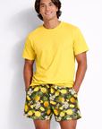 Man wearing a yellow t-shirt and Men's RF-Wear Pineapple Paradise Shorts