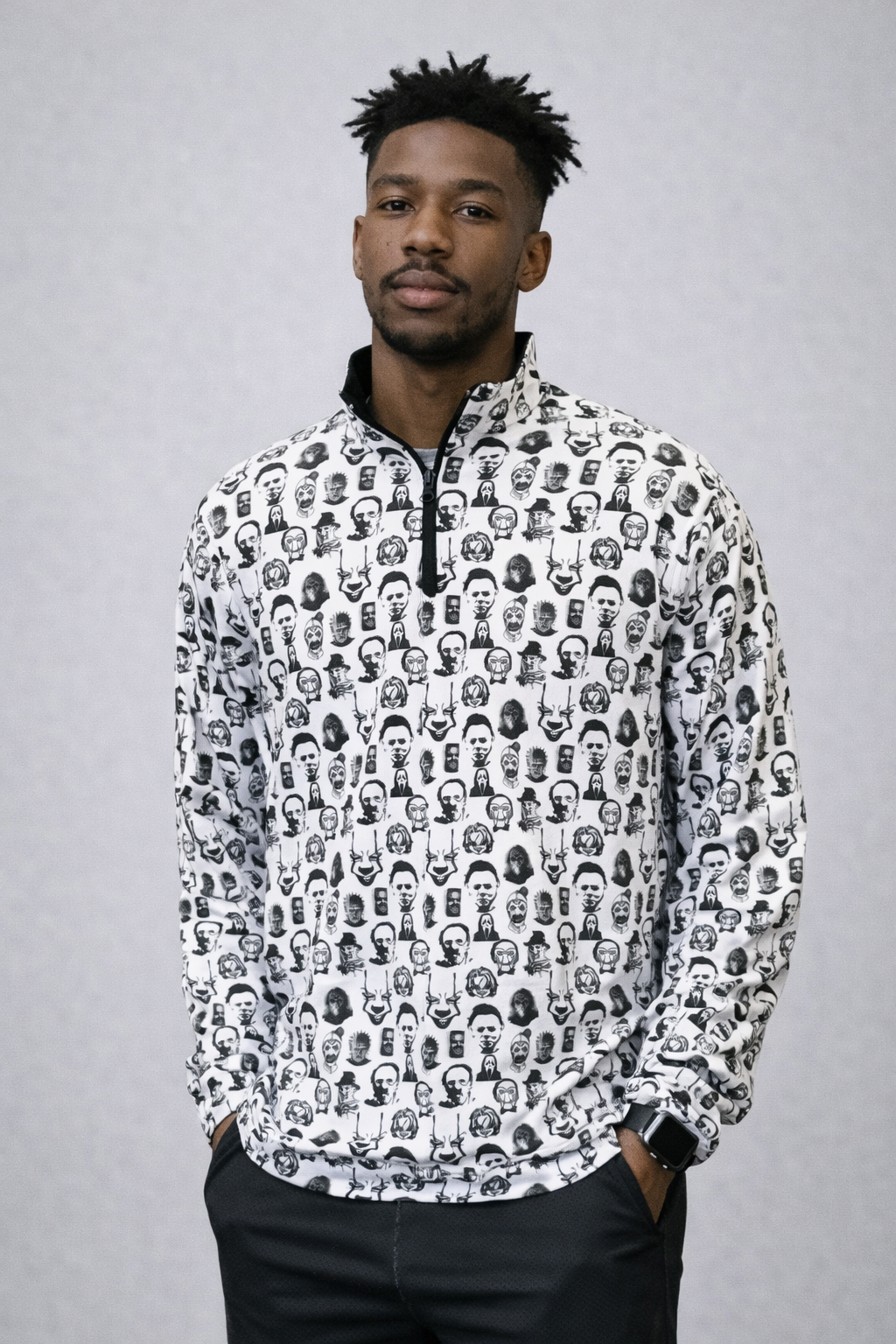 Man wearing black pants and RF-Wear Men's Quarter Zip Horror Faces Top  in White 