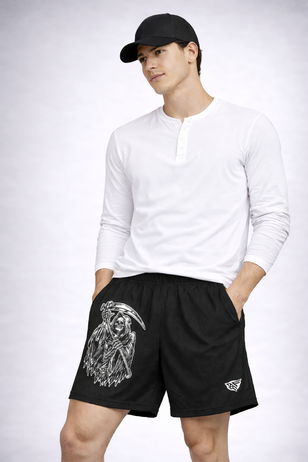 Man wearing a white top and RF-Wear Men's Reaper Shorts in Black