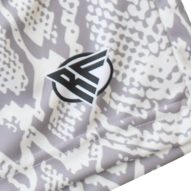 Close-up of RF-Wear Men's Snakeskin Shorts in Cream/Grey with RF logo