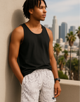 Man wearing a black tank top and RF-Wear Men's Snakeskin Shorts in Cream/Grey 