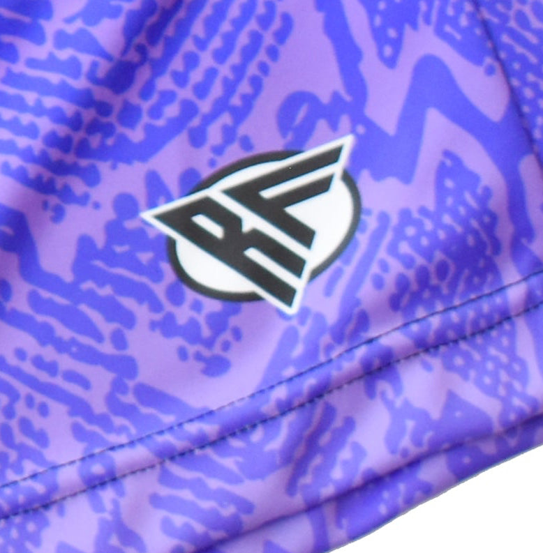 Close-up of RF-Wear Men's Snakeskin Shorts in Purple with RF logo