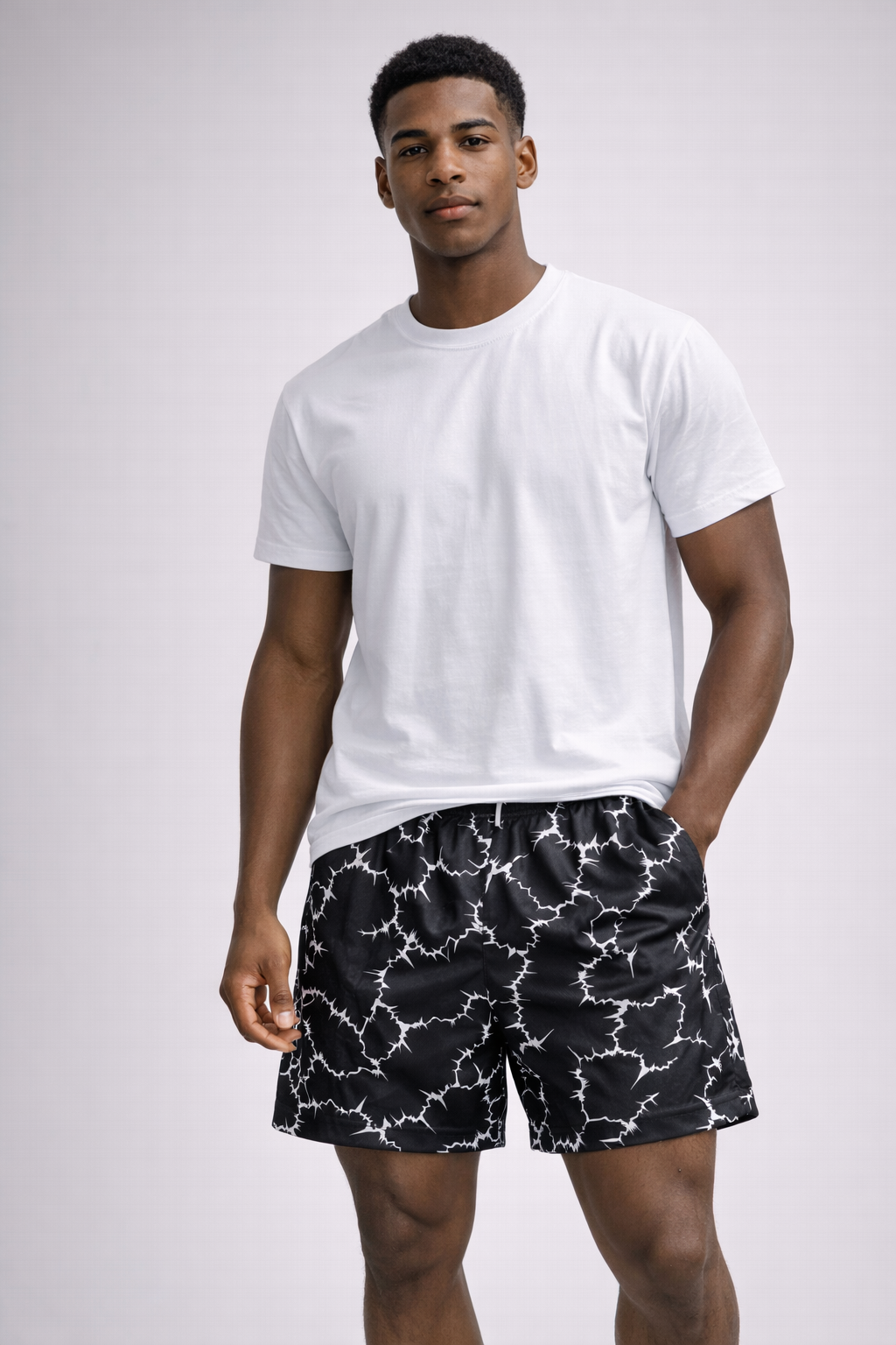 Man wearing  white t-shirt with RF-Wear Men's Sparks Shorts in Black/White