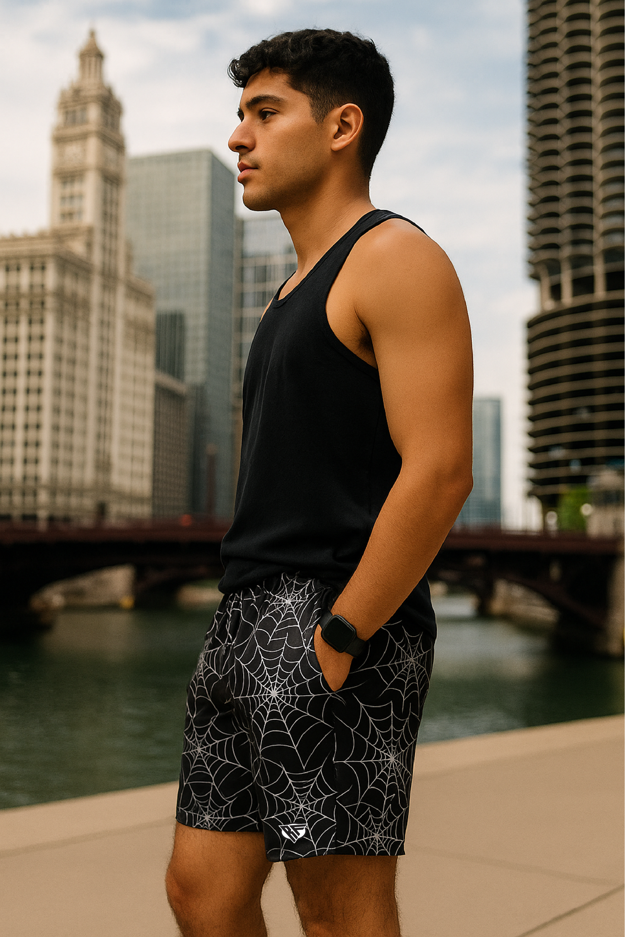 Man wearing a black tank top and RF-Wear Men's Spider Web  Shorts in Black