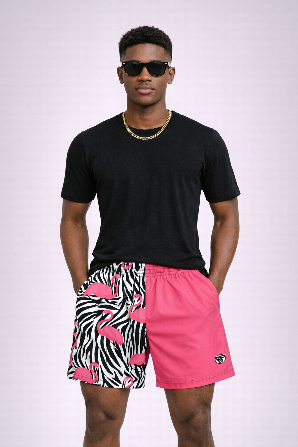 Man wearing a black t-shirt and RF-Wear Men's Split Flamingo Shorts in Pink