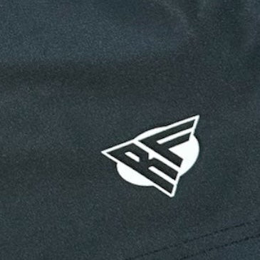 Close-up of RF-Wear Men's Split Sunflower Shorts in Black/Yellow with RF logo