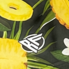Close-up of RF Wear Men's Swim Trunks in Pineapple Paradise with RF logo