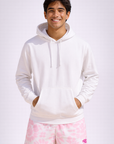 Man wearing a white hoodie and RF-Wear Men's Tie Dye Shorts in Pink