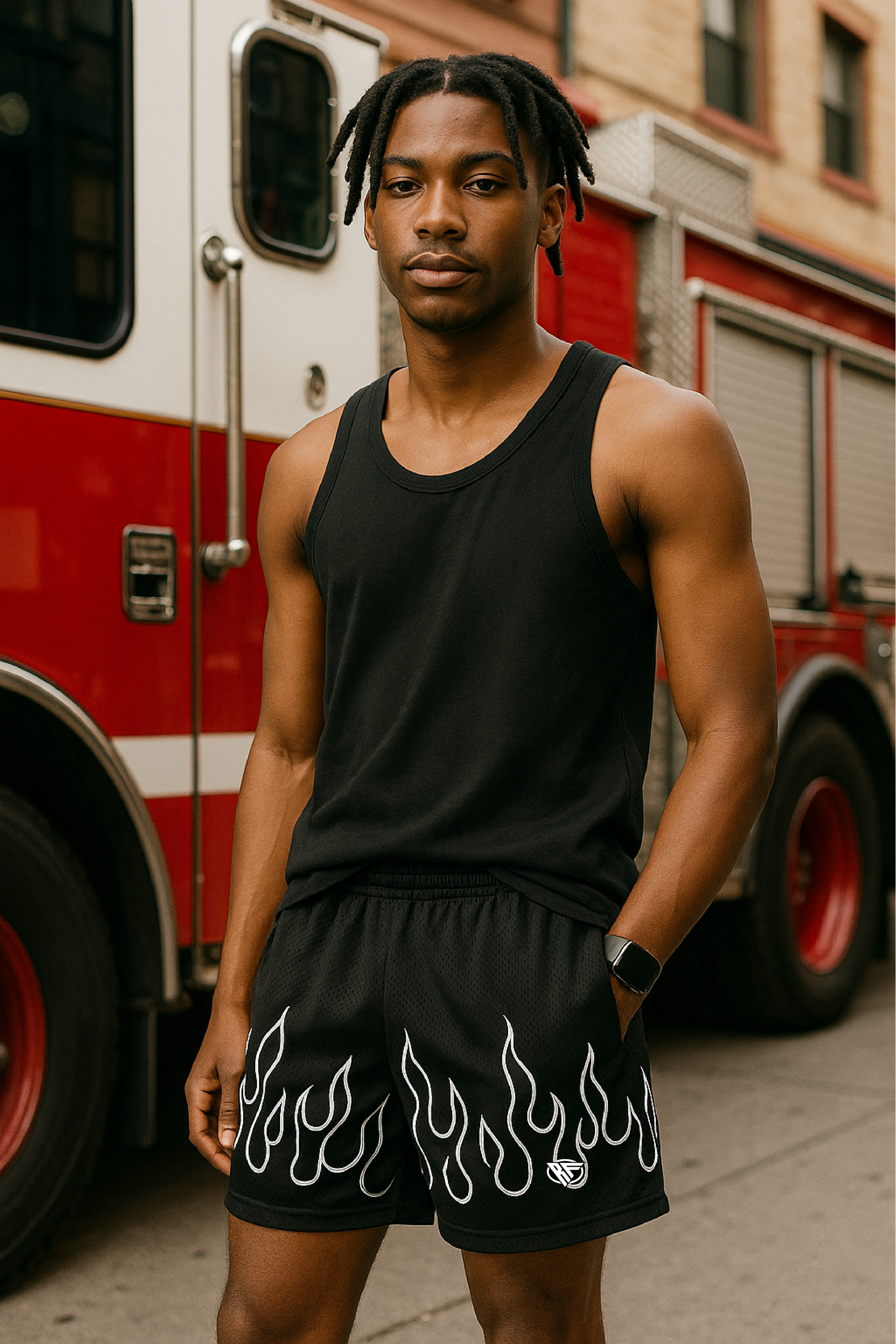 Man wearing black tank top and RF-Wear Men's Mesh Fire Shorts in Black/White.