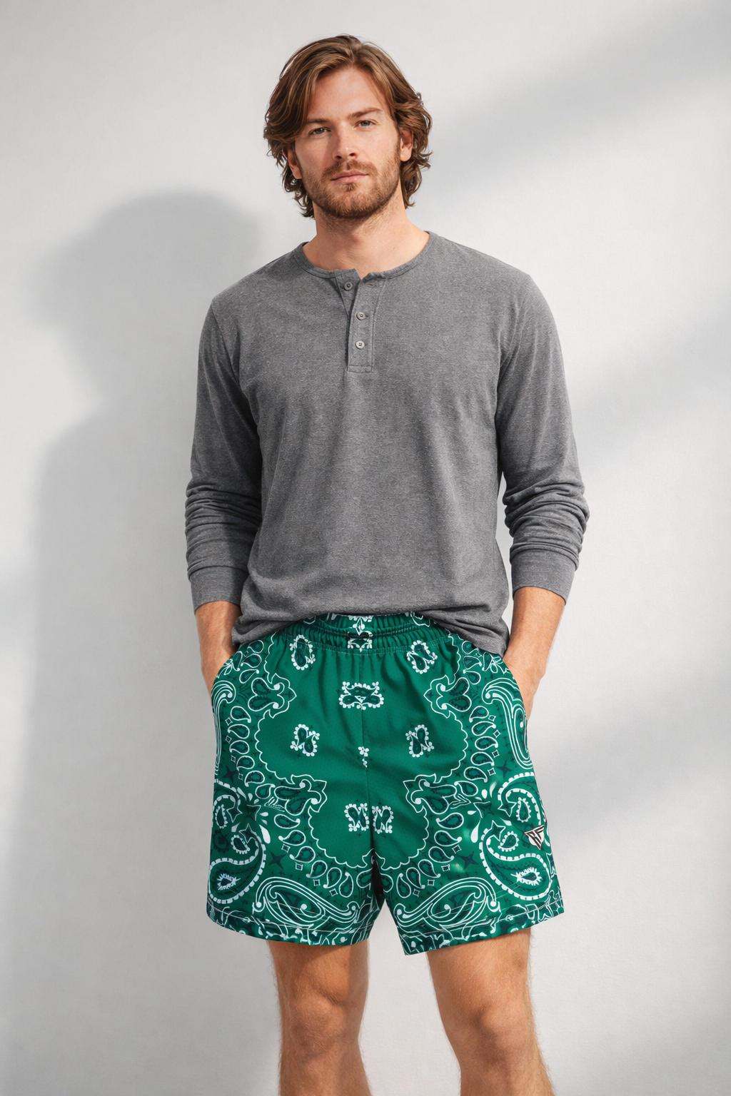 Man wearing a grey shirt and RF-Wear Men's Mesh Bandana Shorts in Green 