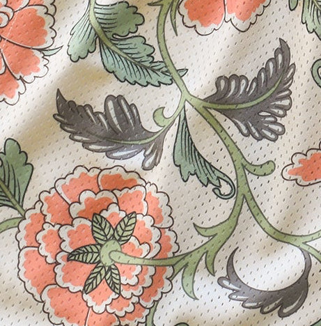 Close-up of floral and leaf pattern on a textured fabric background