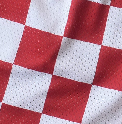 Close up of RF-Wear mesh checkered shorts in red and white.