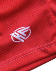 Close up of mesh solid color shorts in red with RF Wear logo