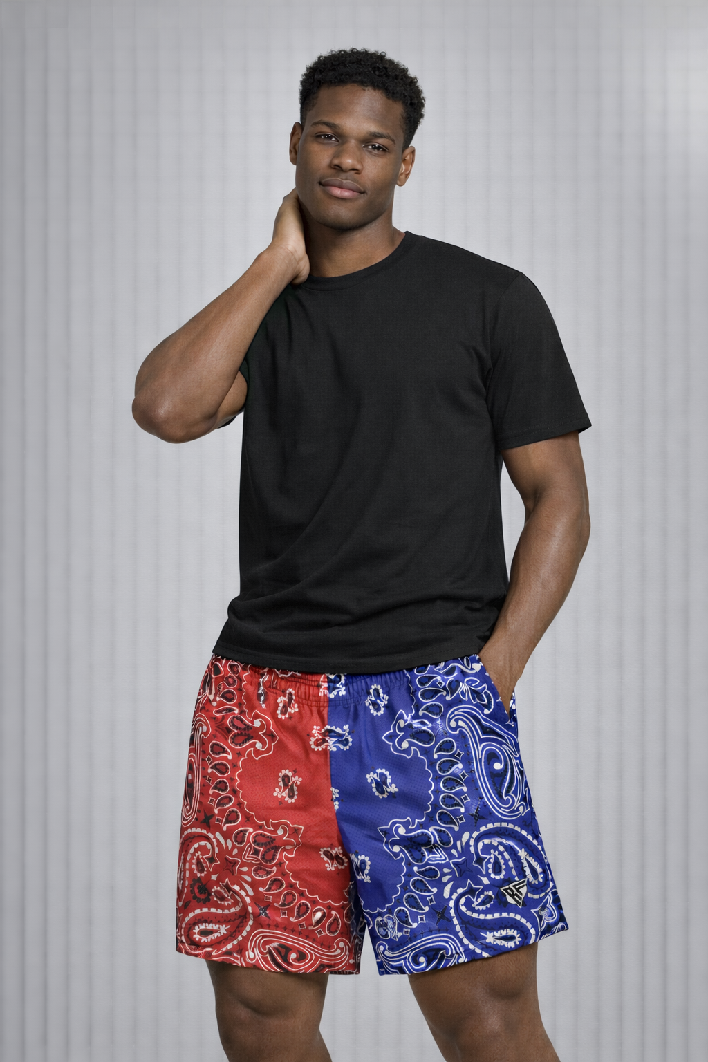 Man wearing a black t-shirt and RF-Wear Men's Mesh Split Bandana Shorts in Red/Blue