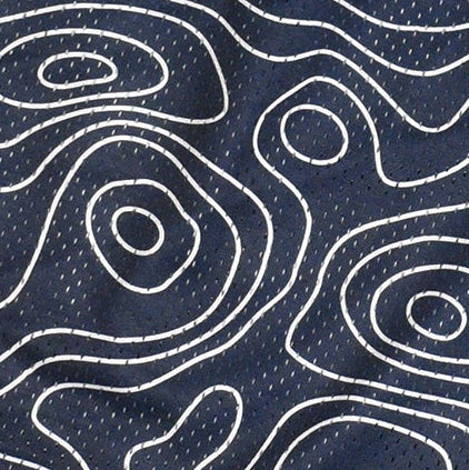 Close-up of RF-Wear mesh topography shorts in Navy/Cream. 