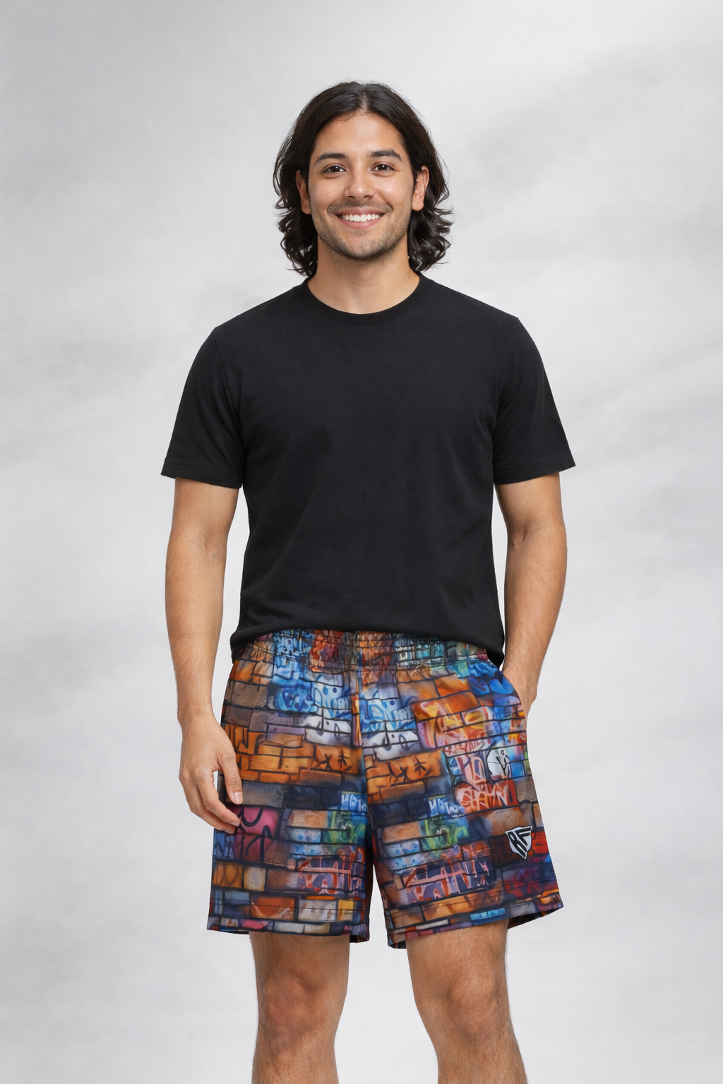 Man wearing  a black t-shirt and RF-Wear Men's Graffiti Wall Shorts in Multicolors
