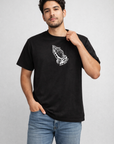 Man wearing jeans and a RF-Wear Praying Hands T-Shirt in Black