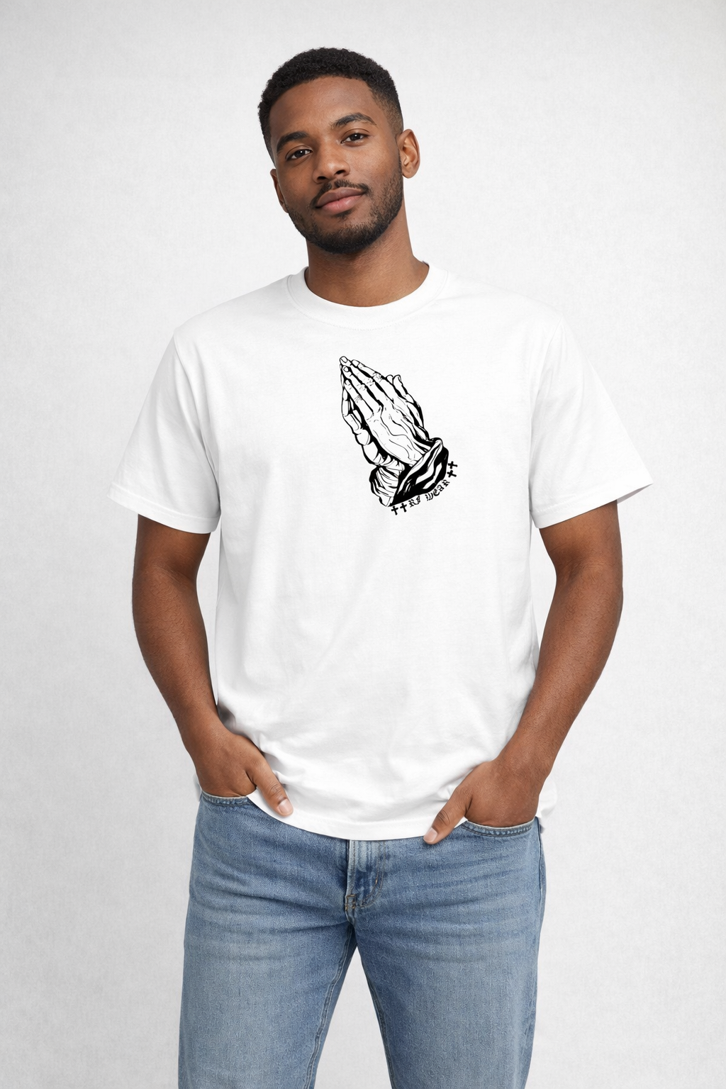 Man wearing jeans and a RF-Wear Praying Hands T-Shirt in White
