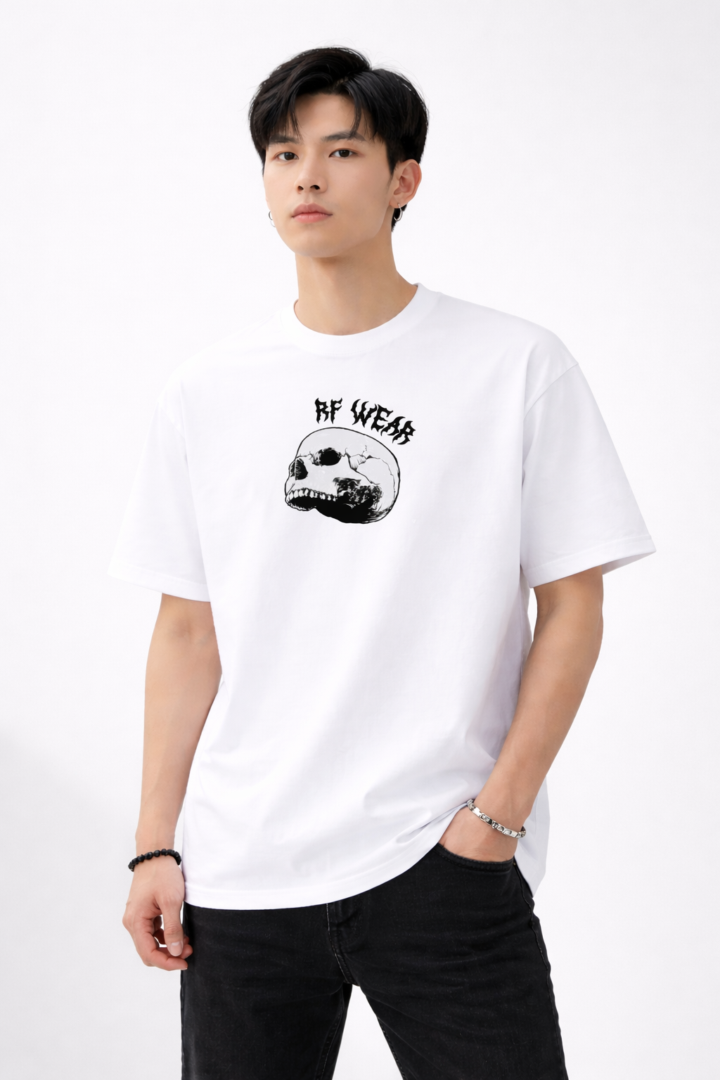 Man wearing black jeans and a RF-Wear Skull T-Shirt in White