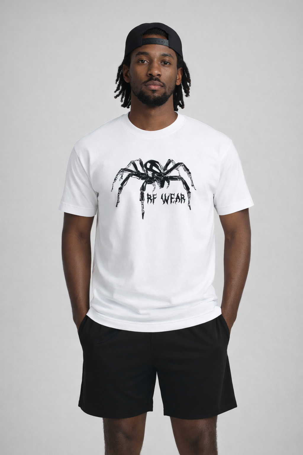 Man wearing black shorts and RF-Wear Spider T-Shirt in White