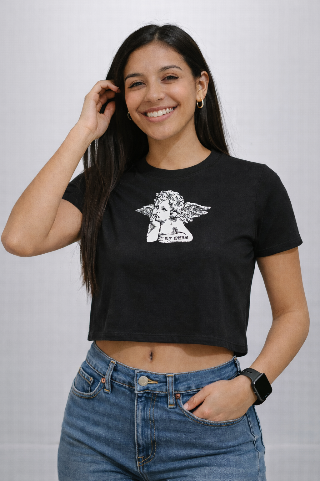 Woman wearing jeans and RF-Wear Women's Cropped Flowy Cherub T-Shirt in Black