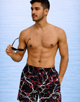 man wearing RF-Wear Swim Trunks - Blossom (Lined) in Black/White