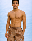 Man wearing RF-Wear Swim Trunks - Desert Camo (Lined) in Brown