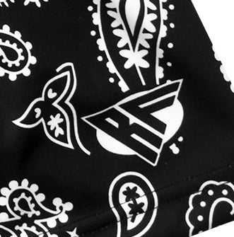 Close-up of RF-Wear Swim Trunks Paisley in Black/White with RF logo