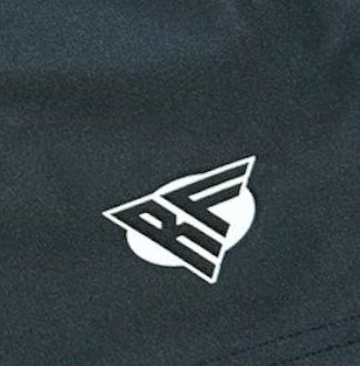 Close-up of RF-Wear Swim Trunks - Split Sunflower in Black/Yellow with RF logo